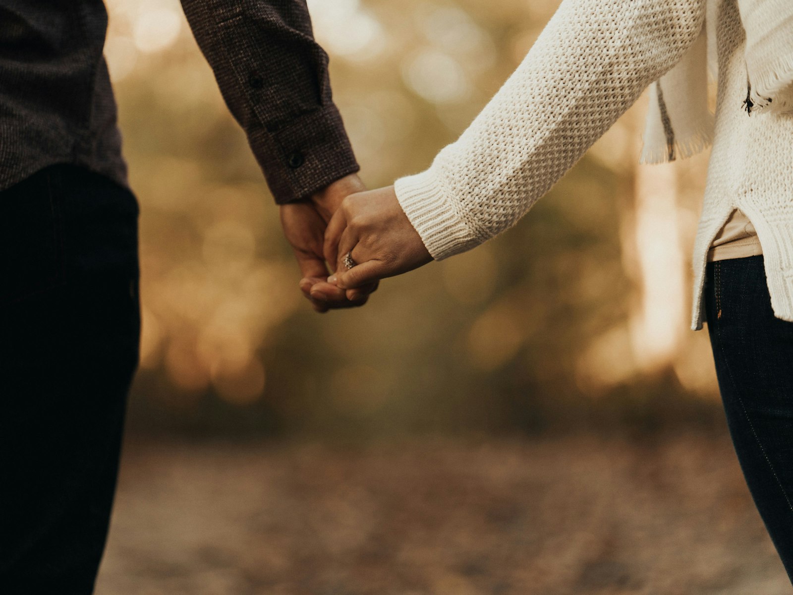 A hopeful couple at home in warm natural light
